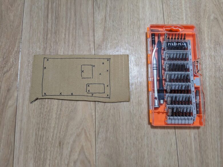 cardboard and precision screwdriver